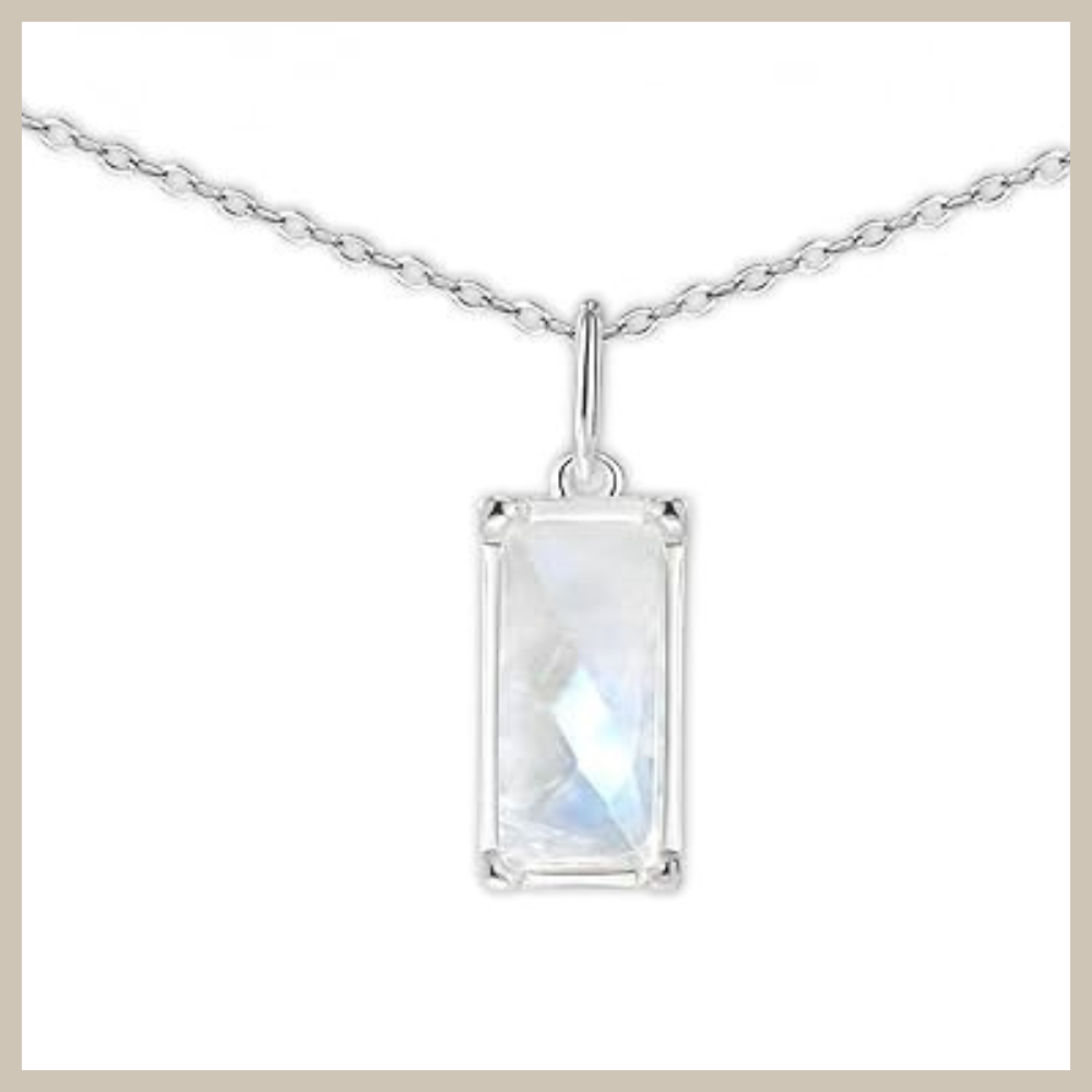 Rectangular faceted rainbow moonstone pendant set in 925 sterling silver on a delicate silver cable chain, minimalist vertical necklace design on white background.